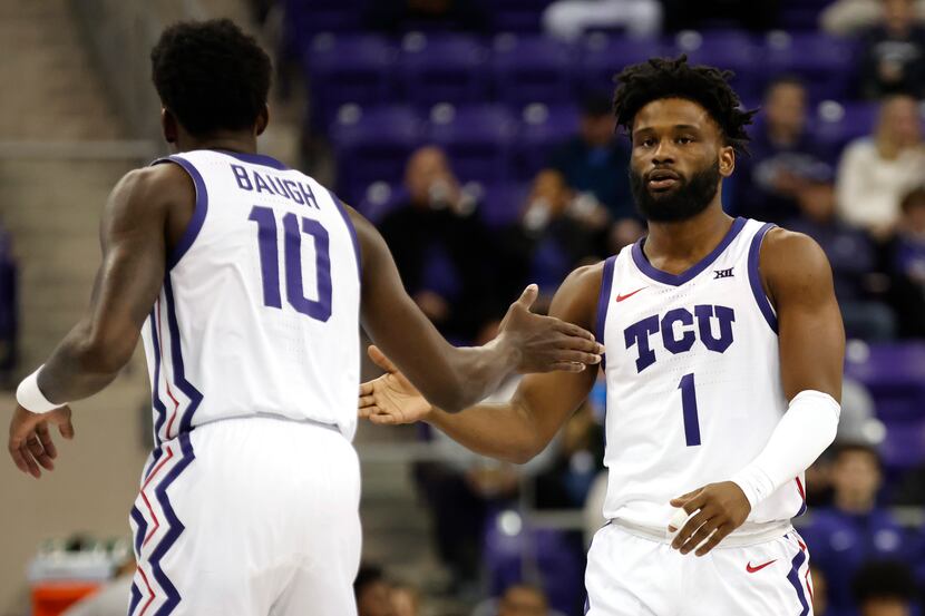 TCU guards Damion Baugh (10) and Mike Miles Jr. (1) celebrate after a basket against...