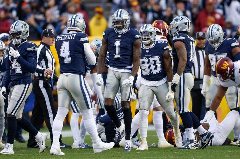 Dallas Cowboys safety Jayron Kearse (1) celebrates with quarterback Dak Prescott (4) after a...