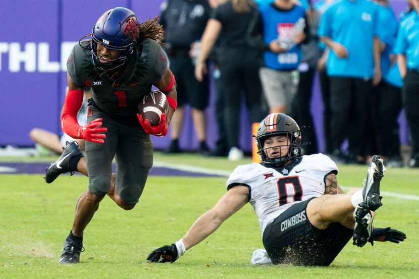 TCU wide receiver Quentin Johnston (1) runs with the ball in front of Oklahoma State...