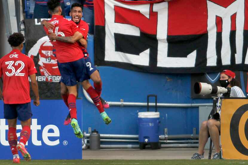FC Dallas forward Ricardo Pepi (16) back to camera receives a celebratory flying hug from...