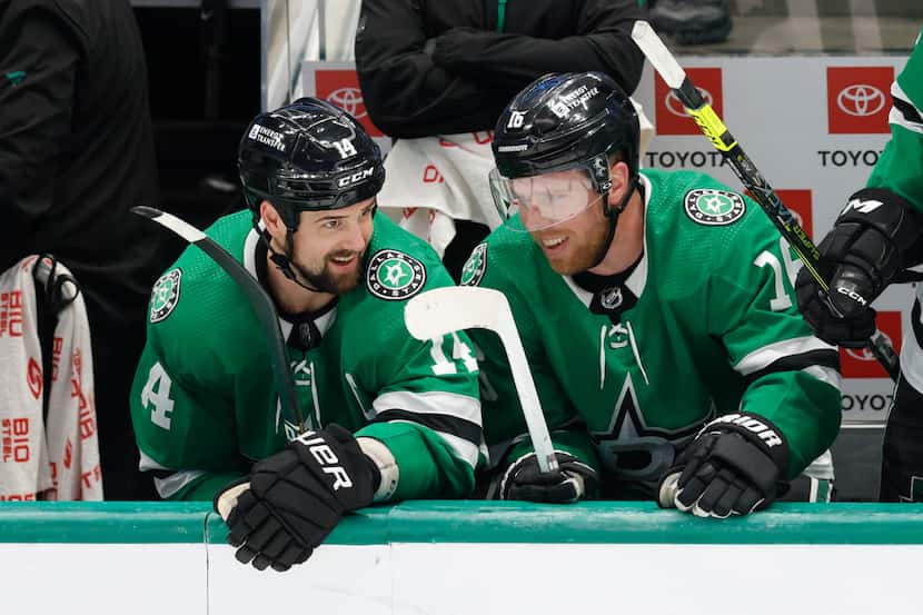 Dallas Stars left wing Jamie Benn (14) and center Joe Pavelski (16) laugh on the bench after...