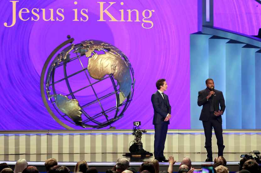 Kanye West, right, answers questions from senior pastor Joel Osteen, left, during the 11...