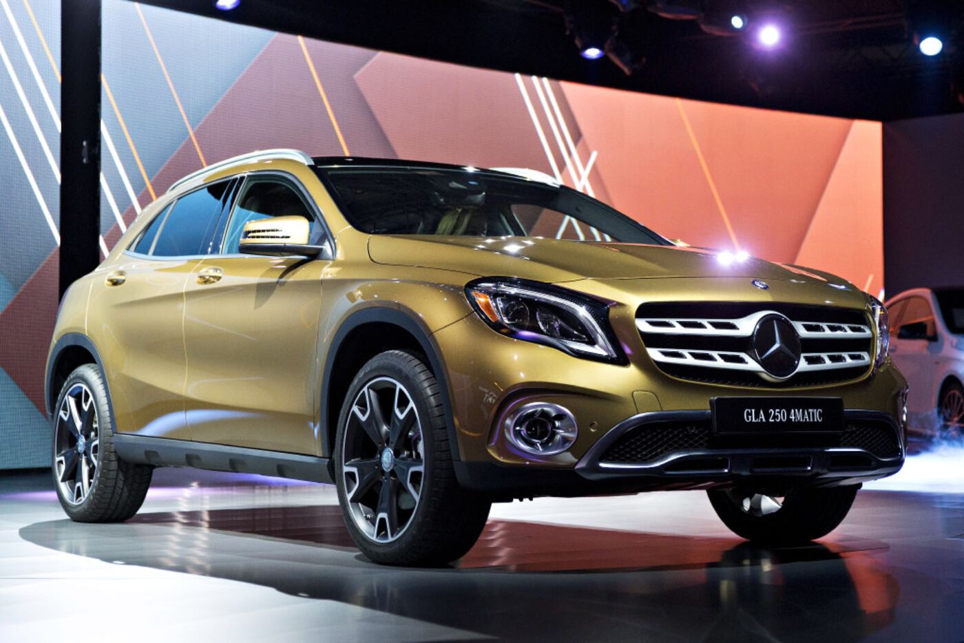 A Mercedes Benz GLA 250 sport utility vehicle (SUV) sits on stage following the vehicle's...