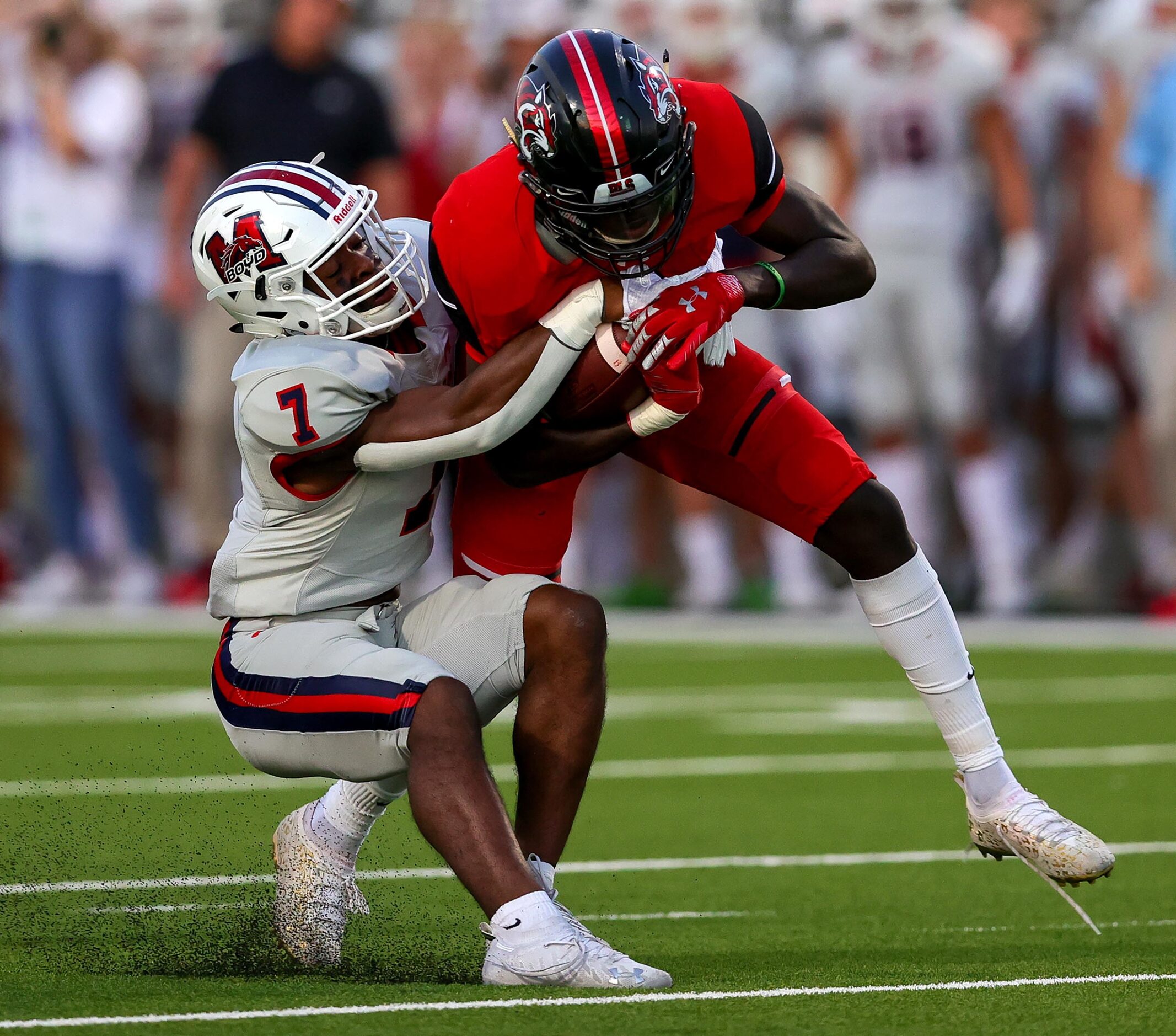 Denton Braswell wide receiver Kinji Hooker (c) comes up with a reception against McKinney...