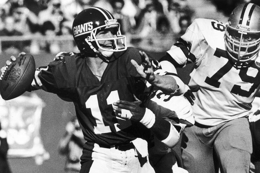 1979 -- Harvey Martin, shown zeroing in on Giants quarterback Phil Simms, played for the...