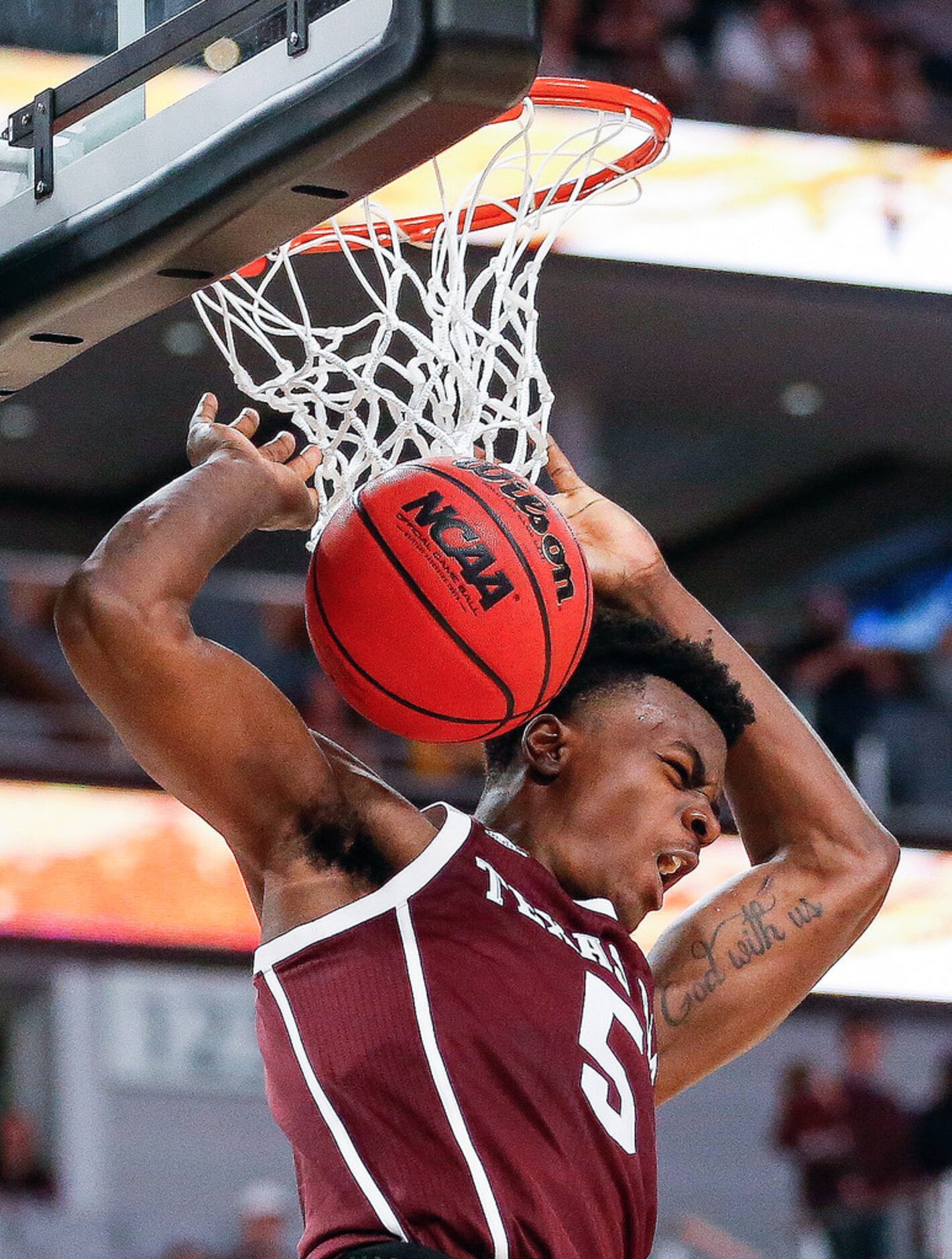 Texas A&M Aggies forward Emanuel Miller (5) scores during the second half of a basketball...