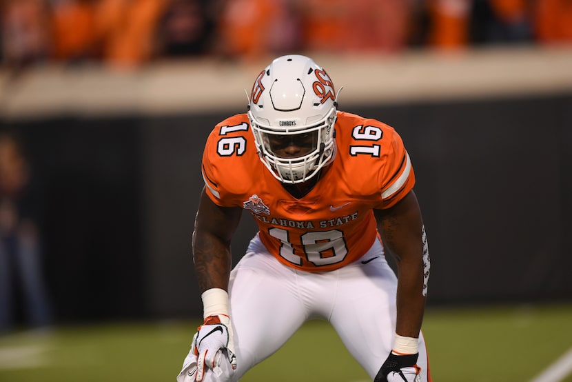 Oklahoma State linebacker Devin Harper warms up prior to an NCAA college football game in...