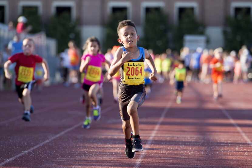 Kelynn Carson, 6, runs the 100m dash in the Luke's Locker All-Comers Track Meet on Tuesday,...