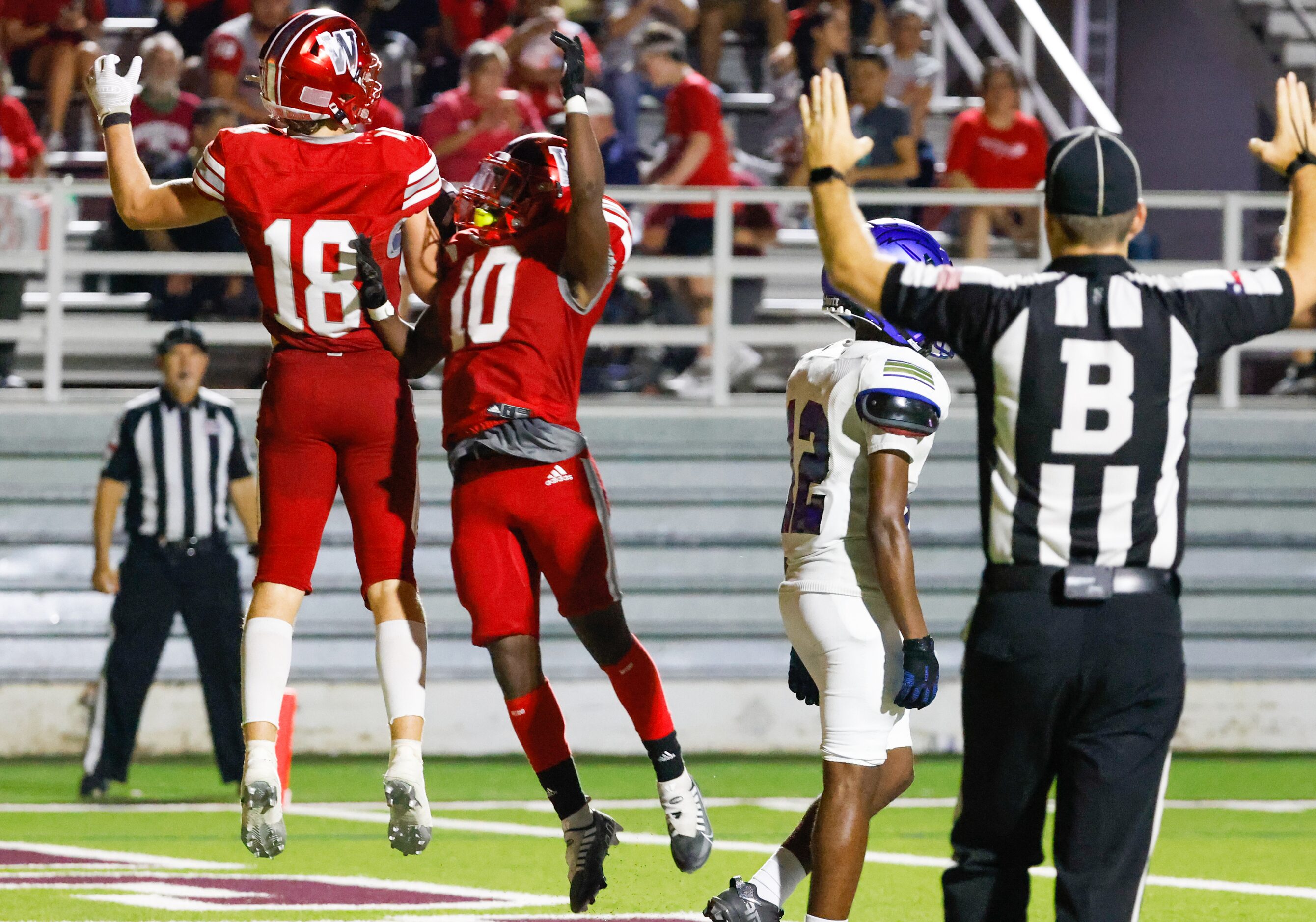 Woodrow Wilson wide receiver Graydon Thompson (18) celebrates his touchdown against Conrad...