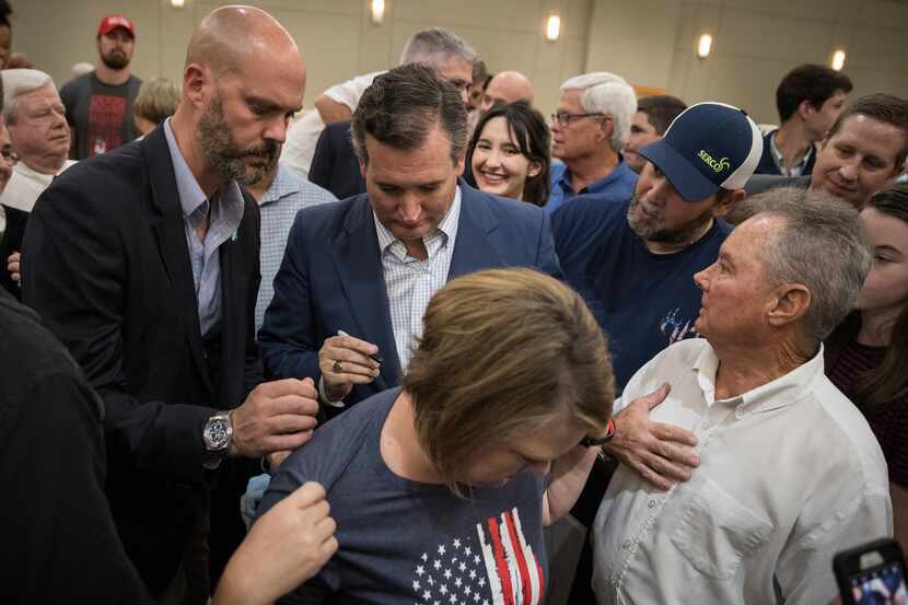 Sen. Ted Cruz signed a supporter's shirt after a rally last week in Conroe. 