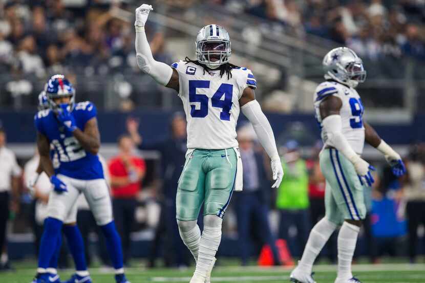 Cowboys middle linebacker Jaylon Smith (54) pumps up the crowd during the third quarter of a...
