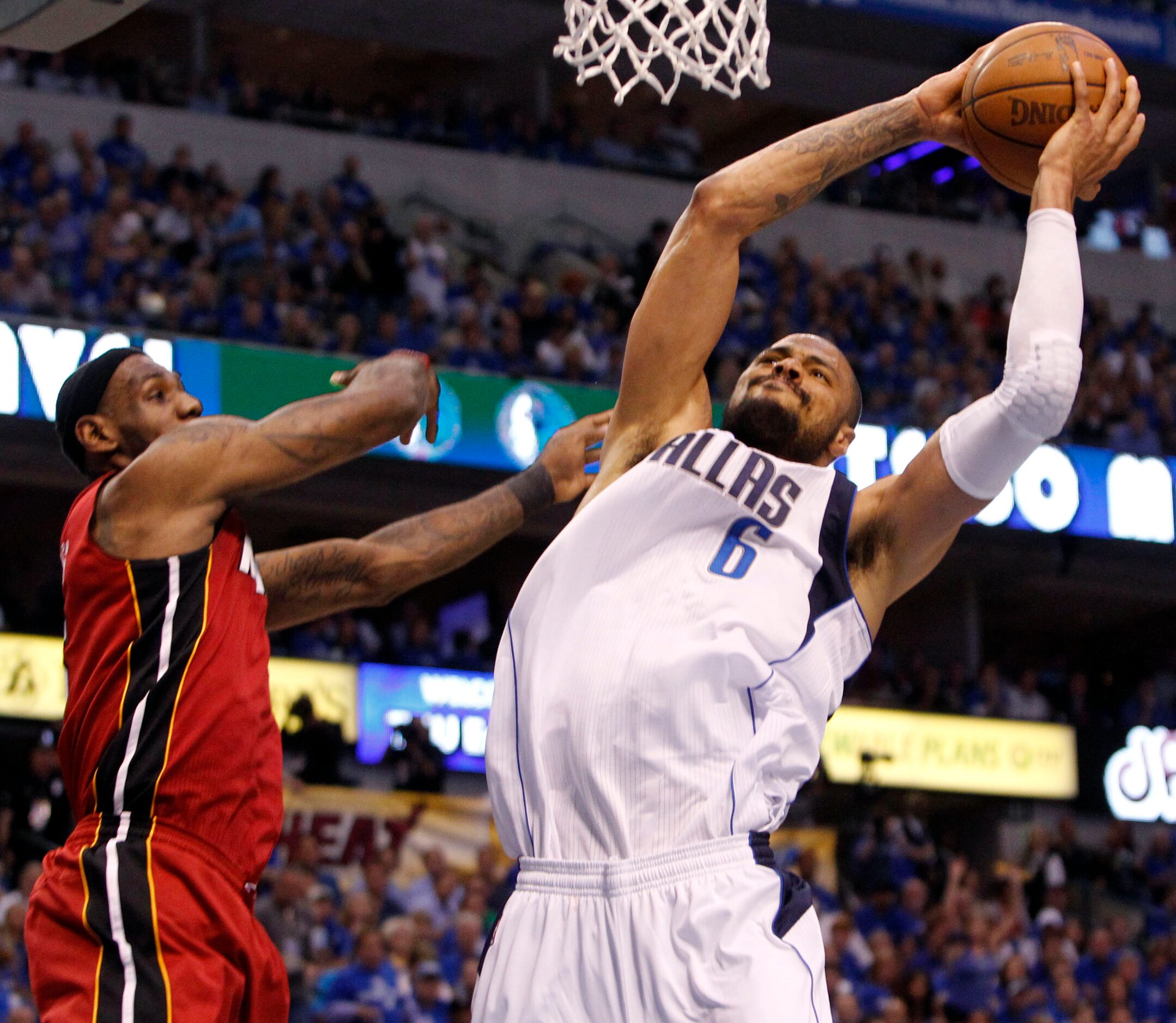 Dallas Mavericks center Tyson Chandler (6) grabs a rebound against Miami Heat small forward...