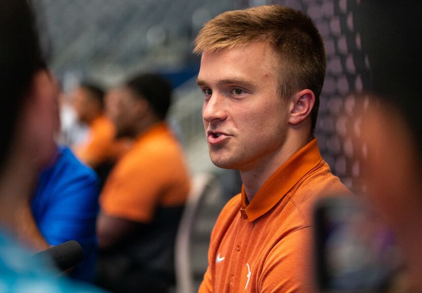 University of Texas football quarterback Sam Ehlinger speaks with reporters during the...