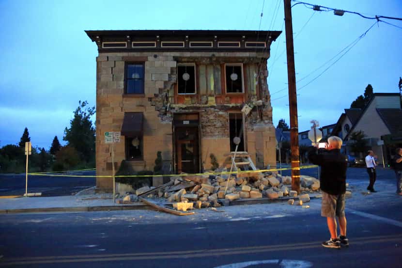 A building housing a wine bar in Napa, Calif., sustained heavy damage in a 6.0 magnitude...