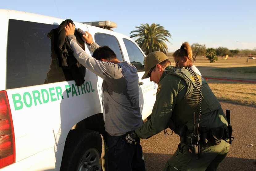 A Border Patrol agent takes a Mexican man into custody in February 2016 for illegally...
