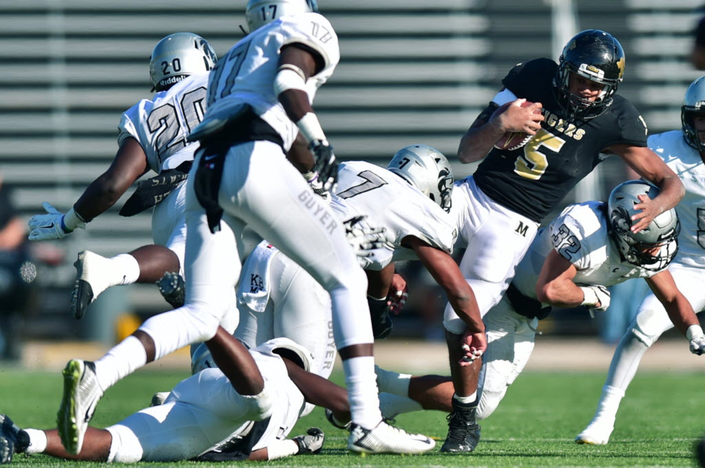 Guyer senior linebacker Dharrius Timmons (7) and senior linebacker Michael Carillo (32)...