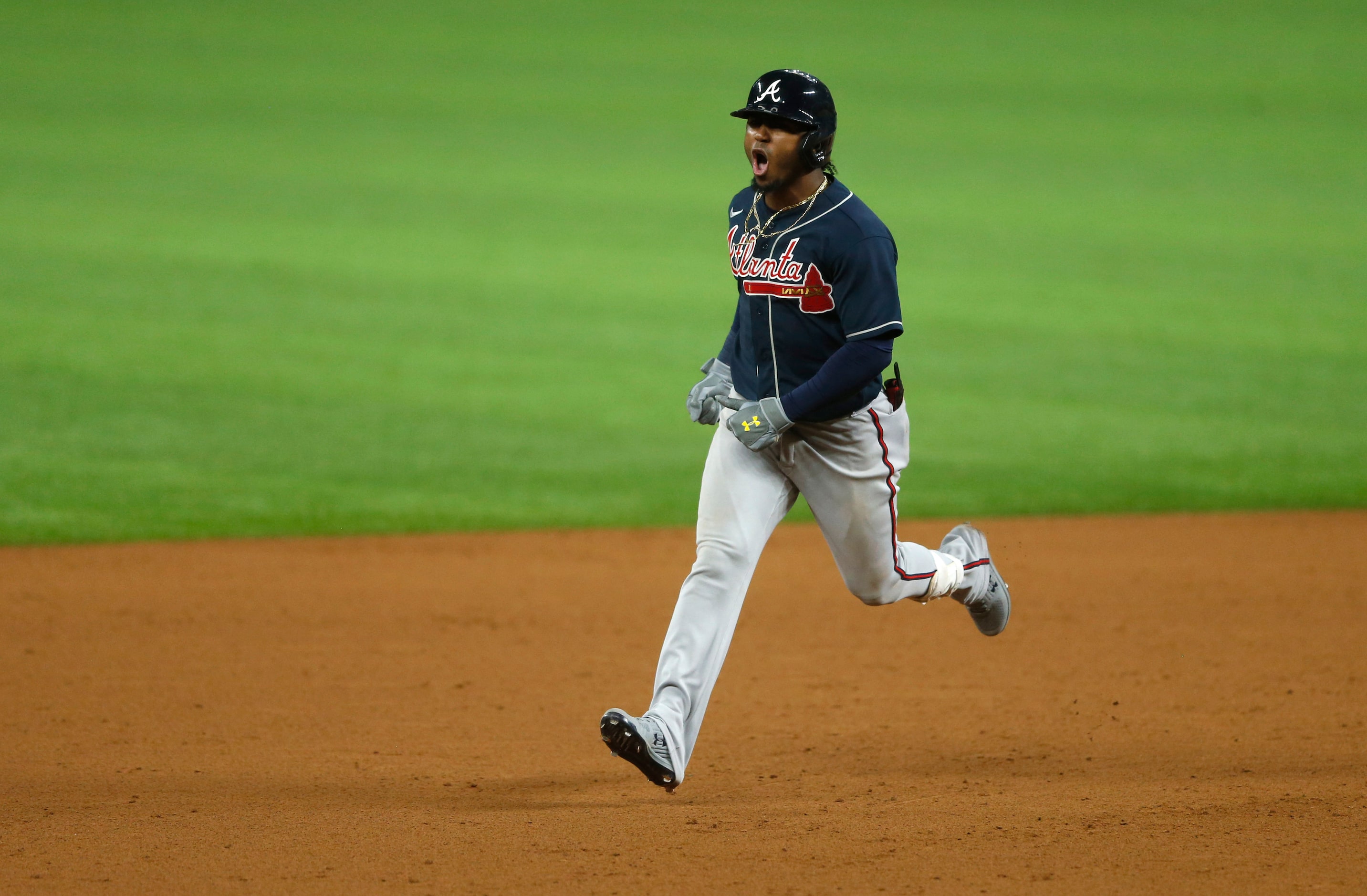 Atlanta Braves second baseman Ozzie Albies (1) celebrates as he rounds the bases after...