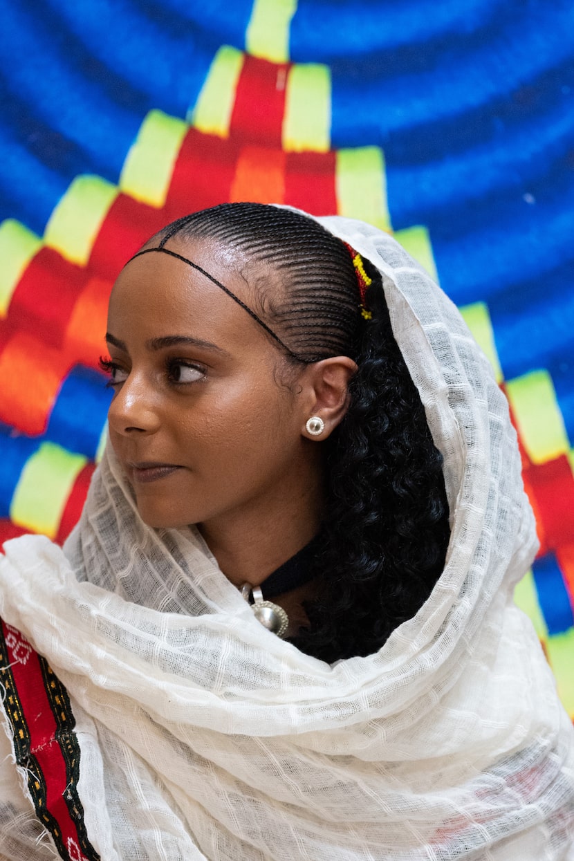 Semien Hagos shows her traditional hair braids and head decor before the start of this...