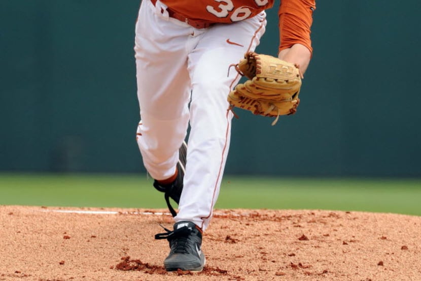 Texas' Nathan Thornhill delivers a pitch during the first inning of a Houston NCAA baseball...