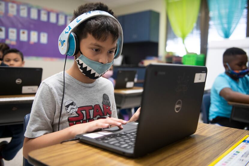 A student in Mesquite ISD participates in a classroom session on a computer.