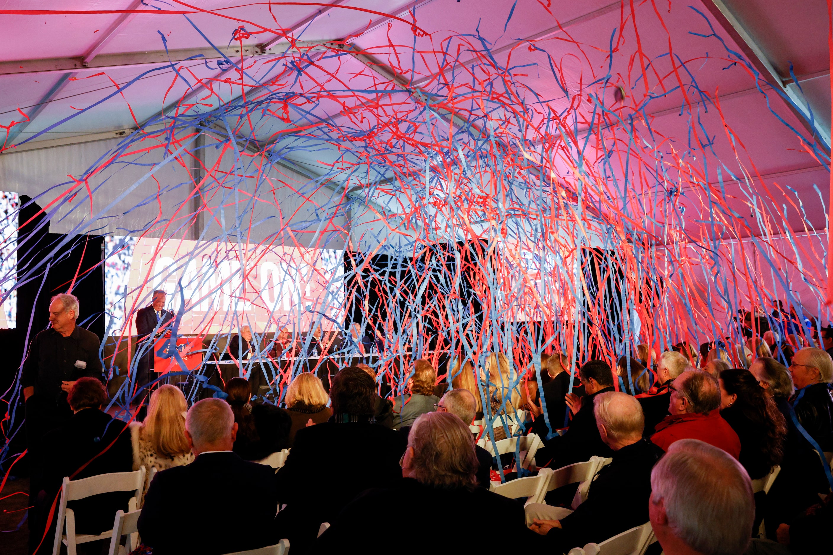 Streamers rain down after the conclusion of a press conference announcing a $50 million gift...