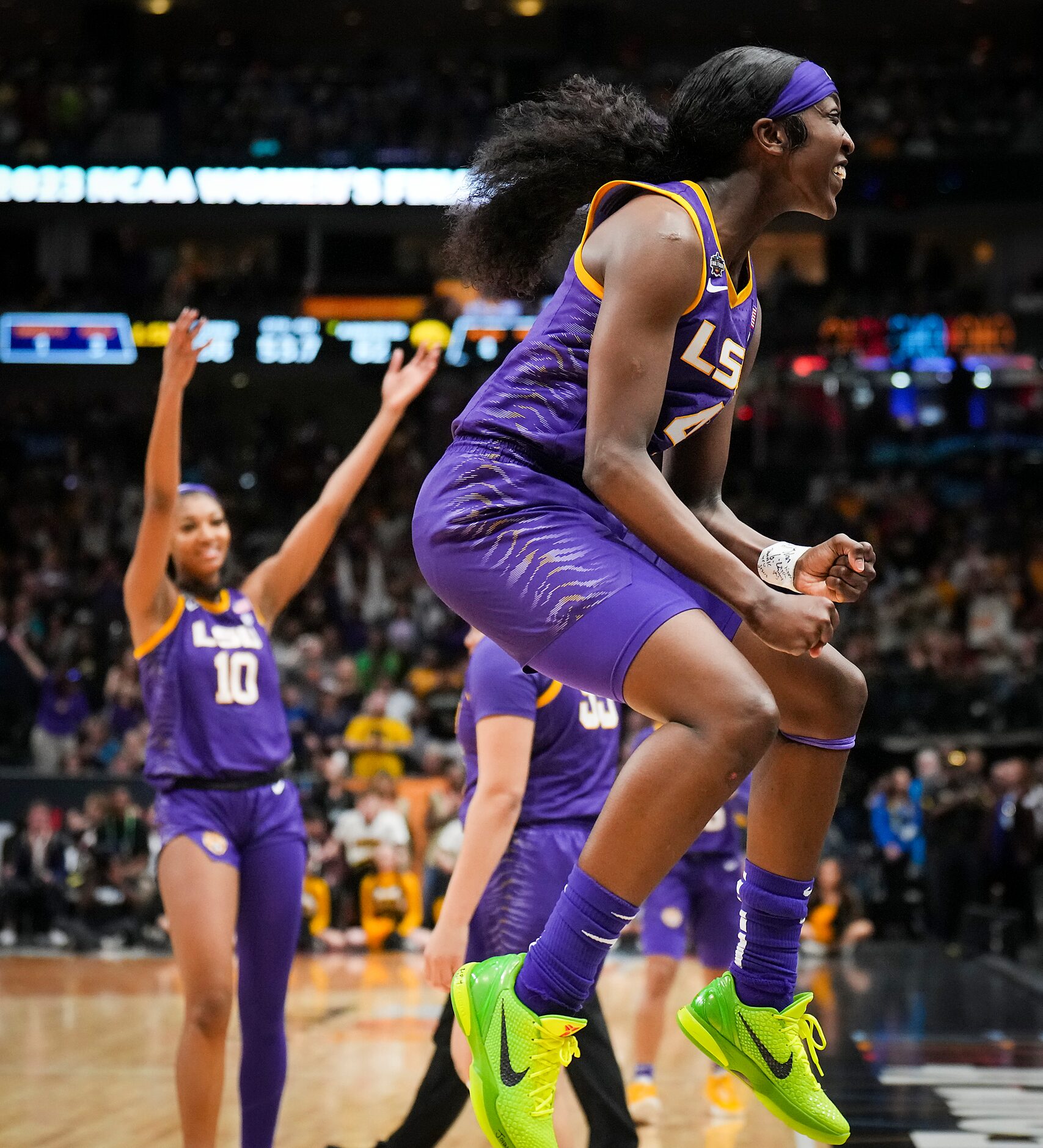 LSU guard Flau'jae Johnson (4) and forward Angel Reese (10) celebrate during the second half...