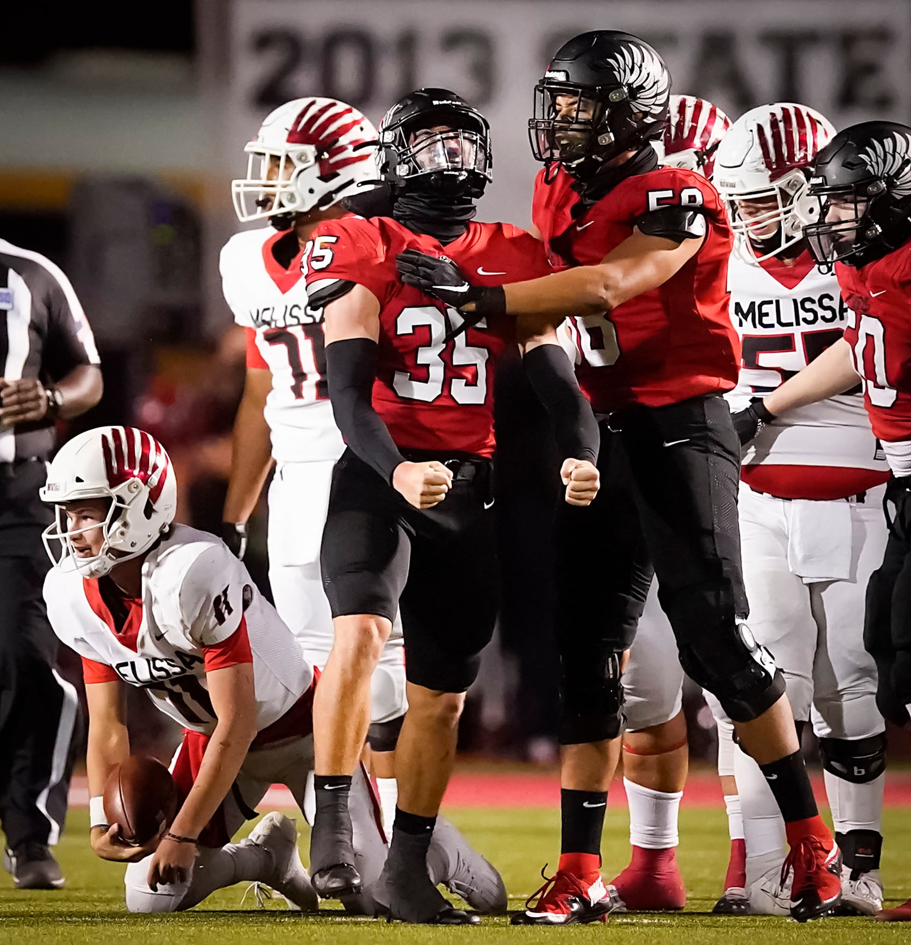 Argyle linebacker Davis Elsey (35) celebrates with defensive lineman Michael Madrie (58)...