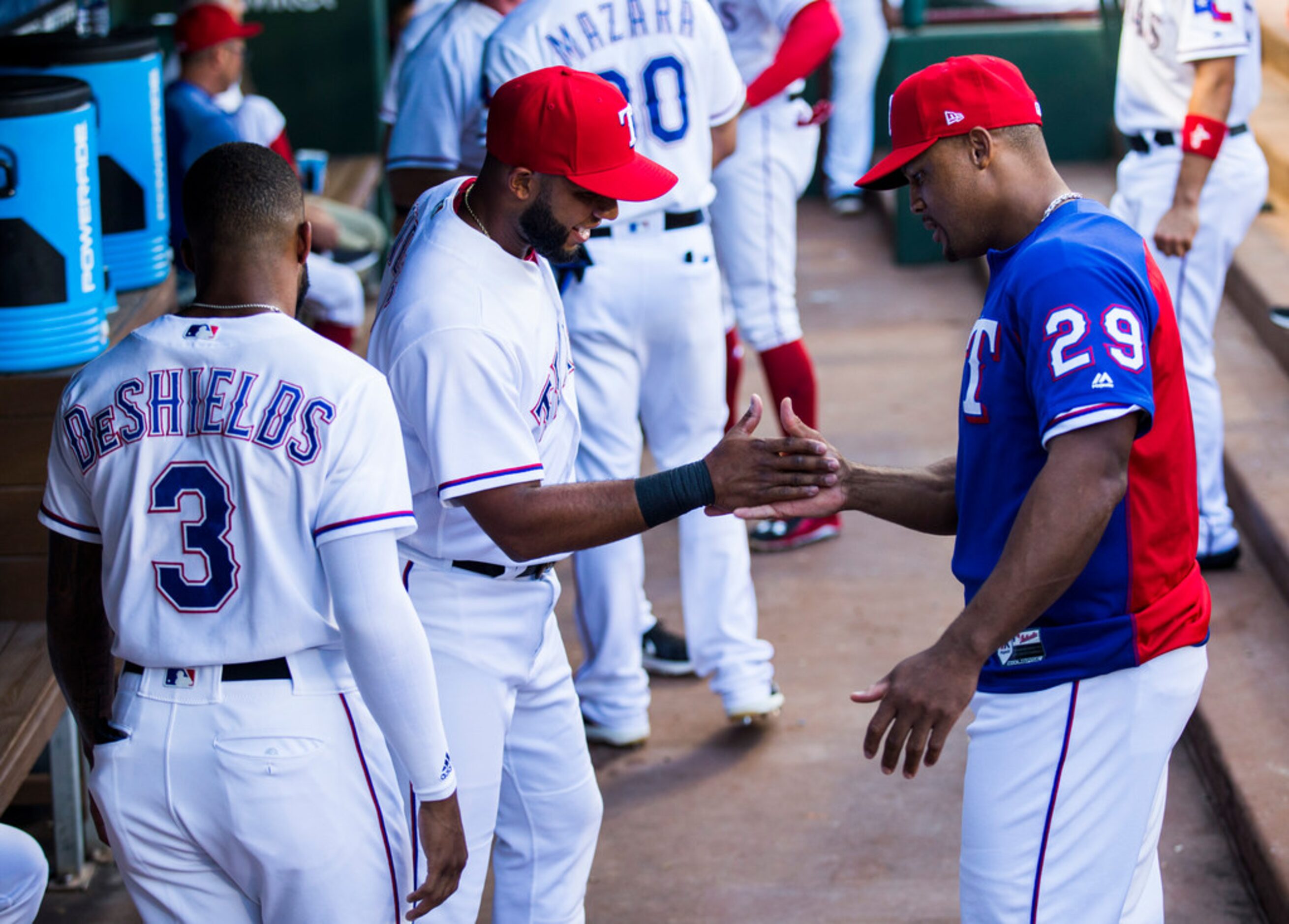 Texas Rangers third baseman Adrian Beltre (29) jokes with Texas Rangers shortstop Elvis...