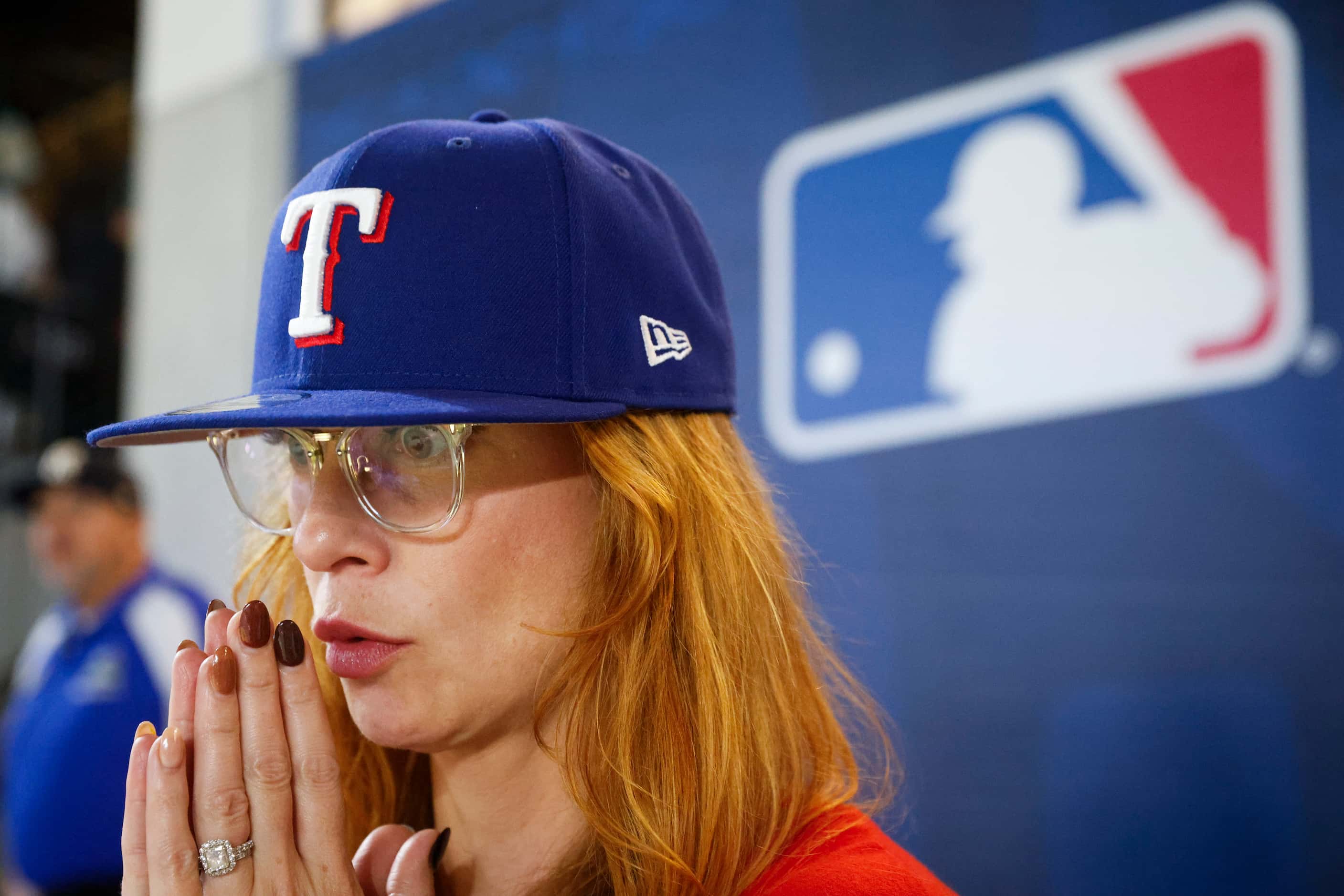 Texas Rangers fan Michelle Grizzle of Coppell watches during the tenth inning of Game 1 of...