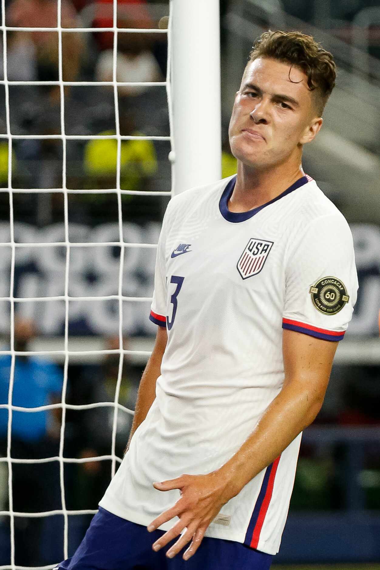 USA forward Matthew Hoppe (13) reacts after missing a shot during the first half of a...