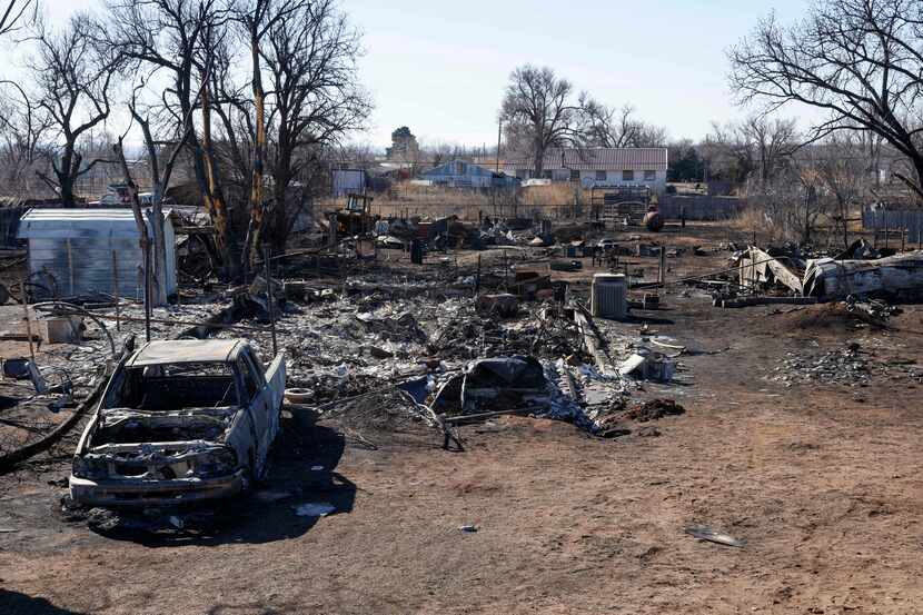 A truck and house destroyed by the Smokehouse Creek Fire are seen, Friday, March 1, 2024, in...
