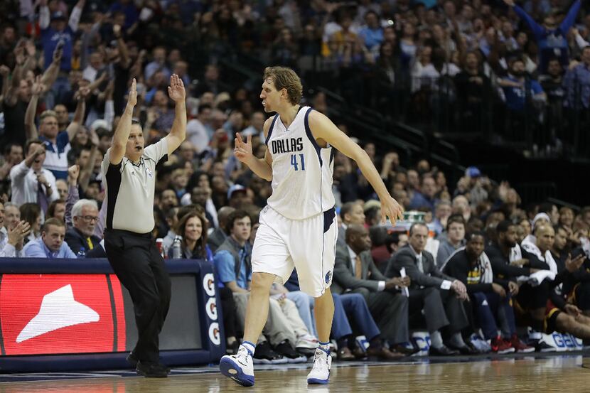 Dirk Nowitzki reacts after a three-pointER against the Cleveland Cavaliers in the second...