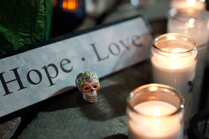 A memorial sits outside a restaurant along Bourbon Street in the French Quarter, Thursday,...