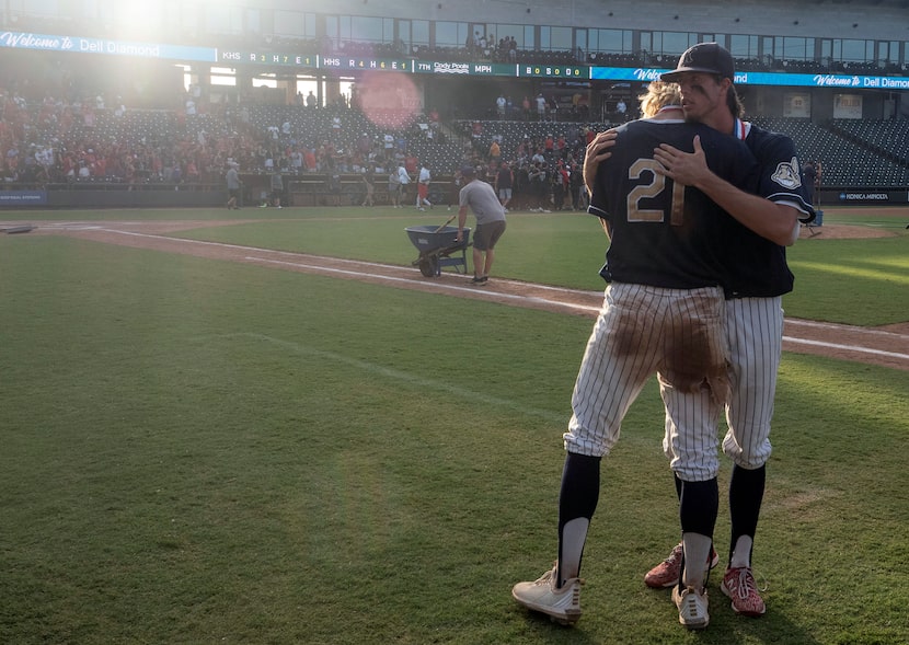 Keller Eric Hammond, (27),  gives teammate, Zach Rike, (21), a hug after coming up short...