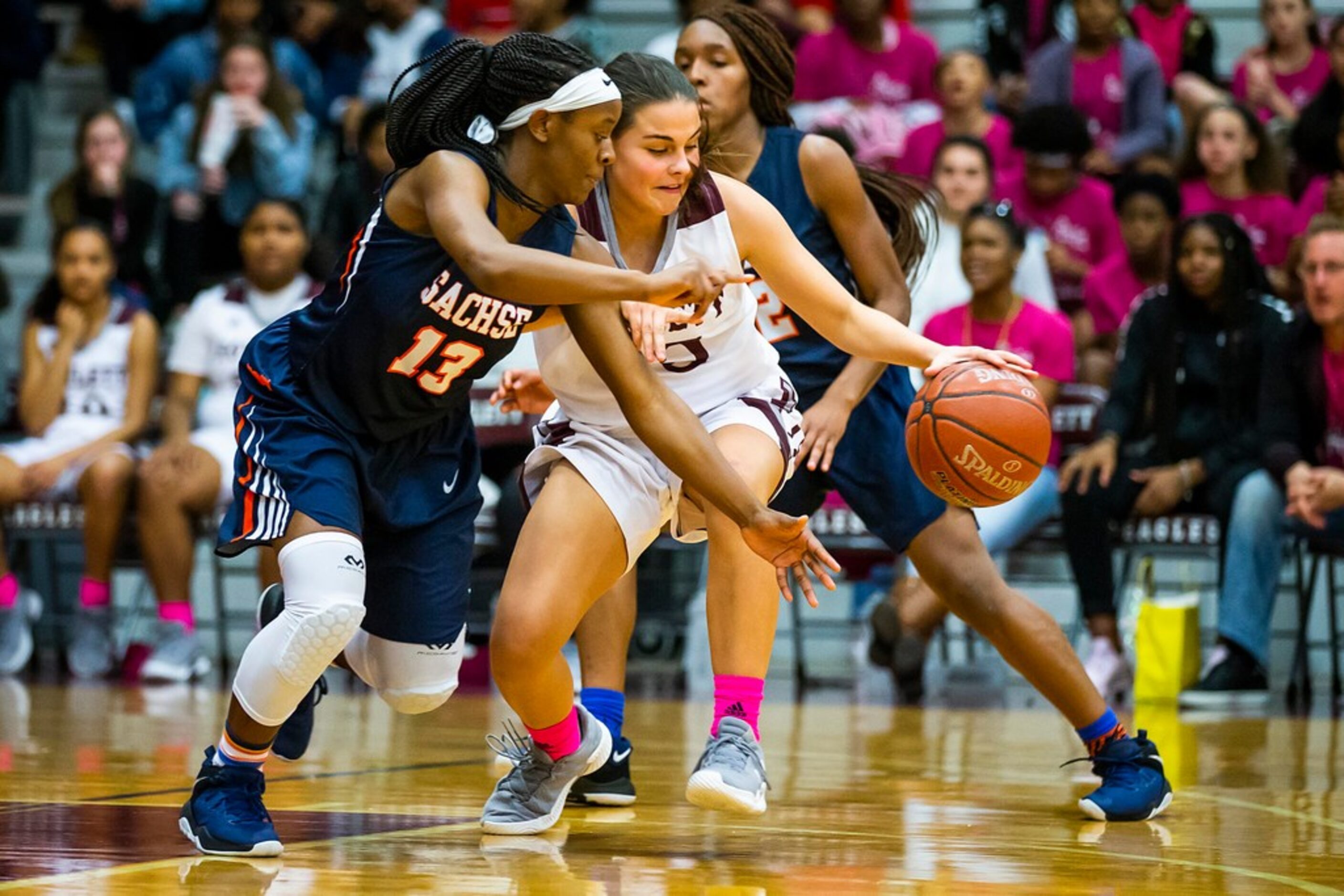 Sachse guard Jayla Brooks (13) tries to steal the ball from Rowlett guard Madi Rodriguez...