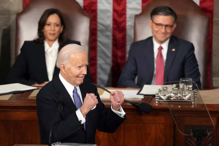 President Joe Biden gestures to Republicans as Vice President Kamala Harris and House...
