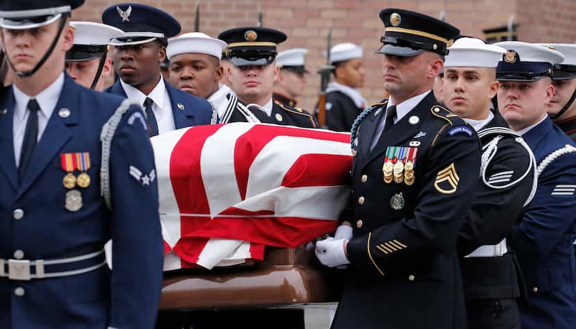 Pallbearers carry the casket at the funeral service for George H.W. Bush, the 41st President...