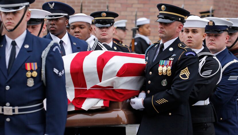 Pallbearers carry the casket at the funeral service for George H.W. Bush, the 41st President...