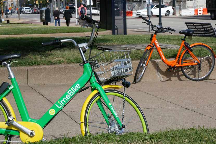 A LimeBike and Spin bike are left in front of Union Station in downtown Dallas on Nov. 1,...