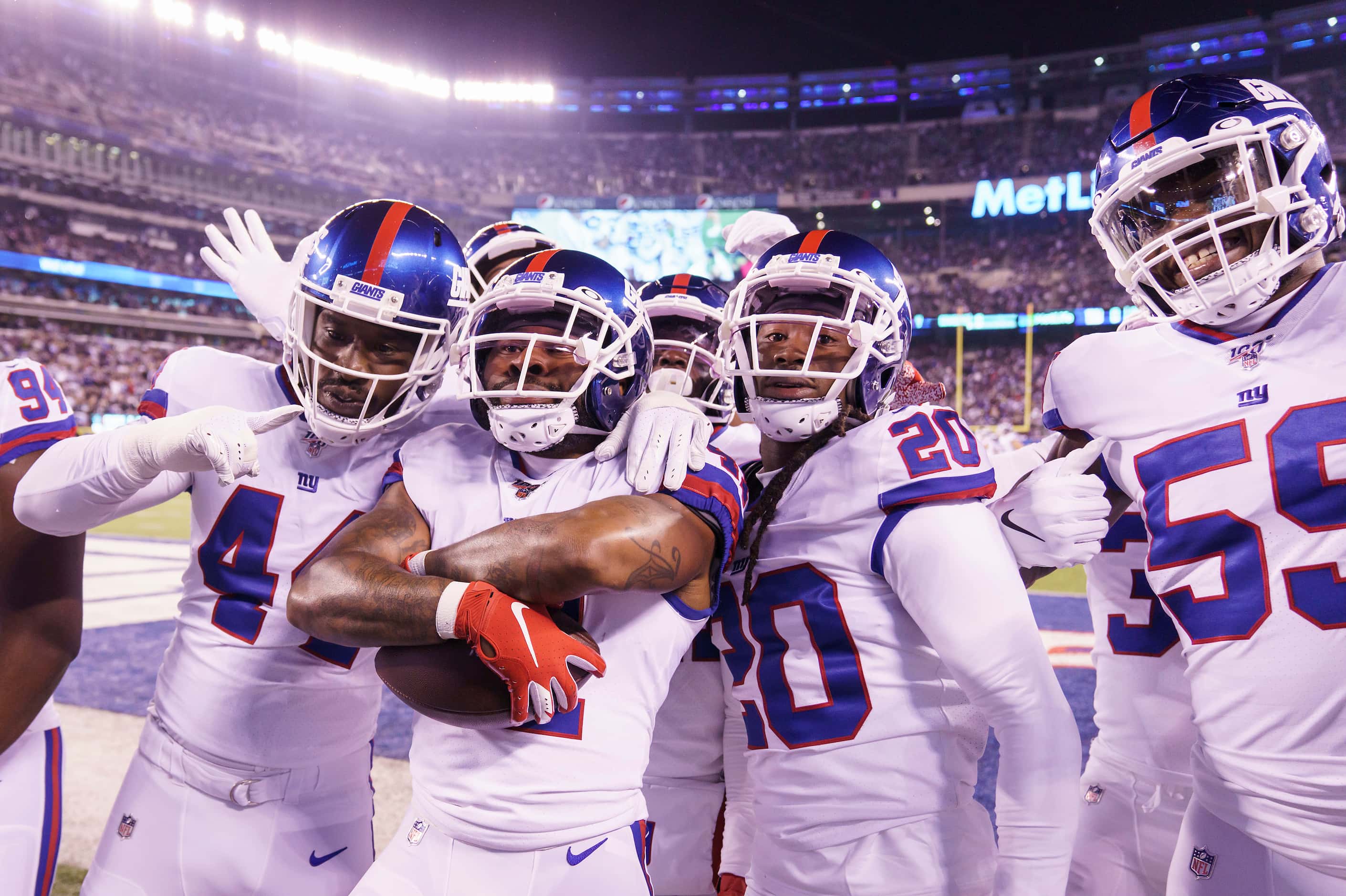New York Giants free safety Antoine Bethea (41) celebrates with teammates after intercepting...