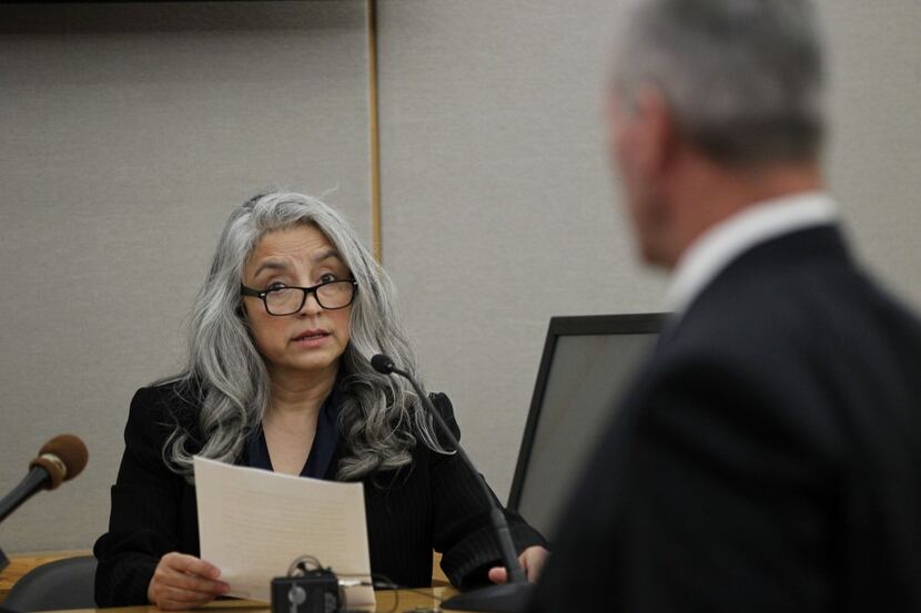 State District Judge Lena Levario answers questions from attorney Ron Poole during a July 15...