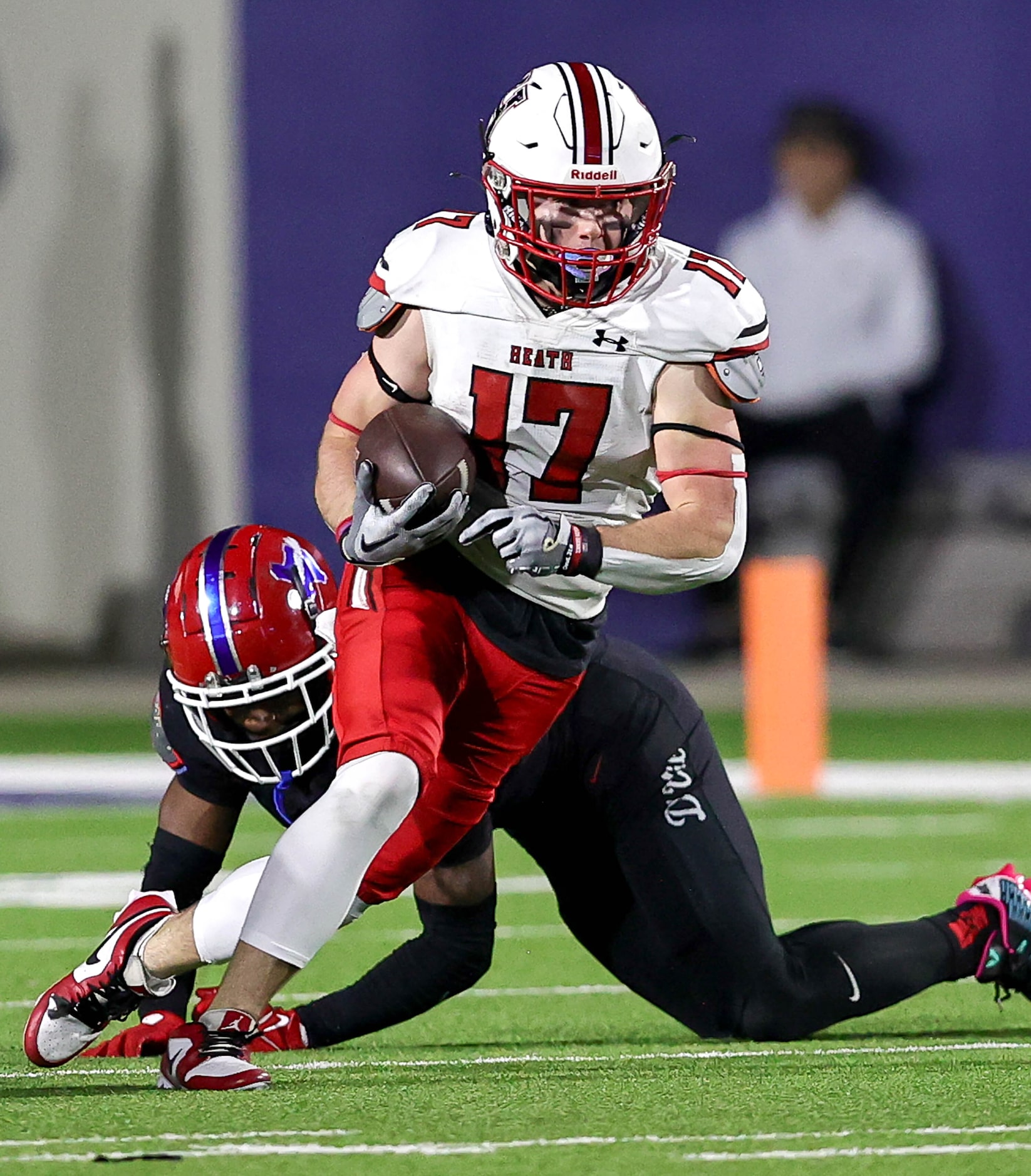 Rockwall Heath wide receiver Jack Davenport finds room to run after making a reception...