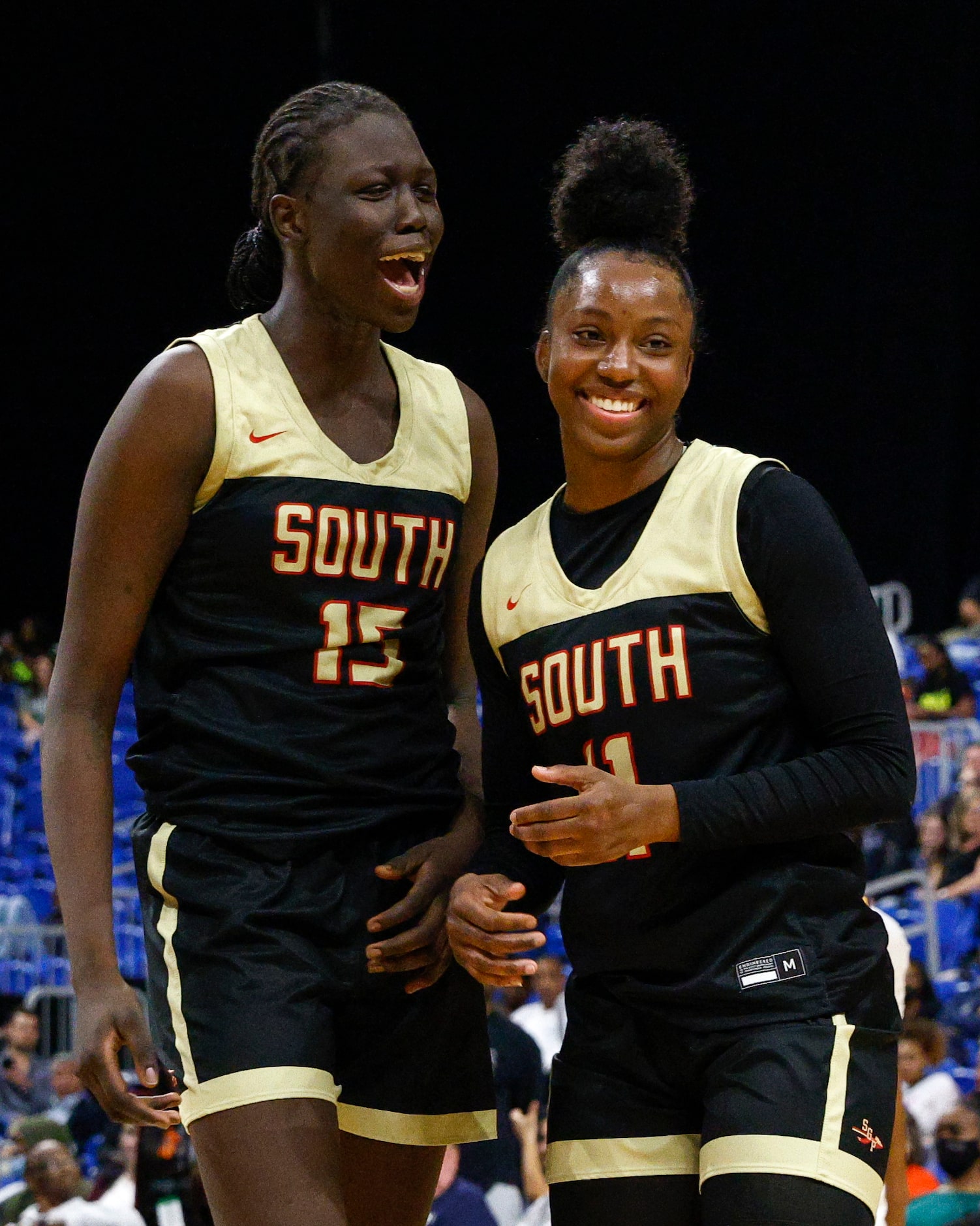 South Grand Prairie center Adhel Tac (15) and South Grand Prairie guard Jahcelyn Hartfield...