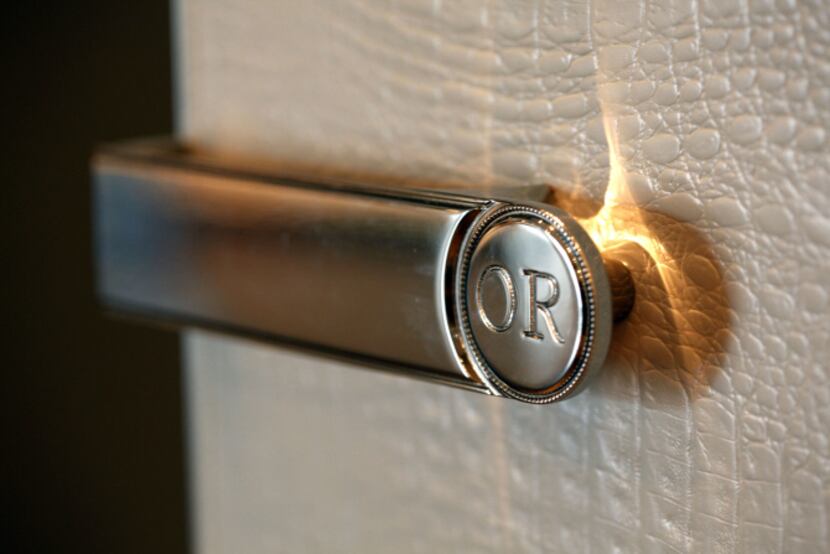 A detail of the handle and closet front of the Monogram closet collection at Ornare