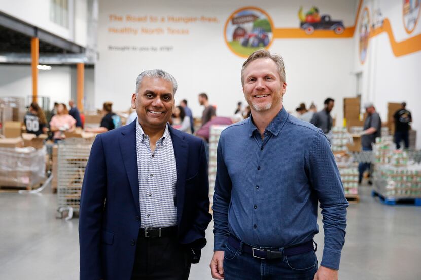 Anurag Jain, chairman of the North Texas Food Bank, is shown with Shiftsmart president...