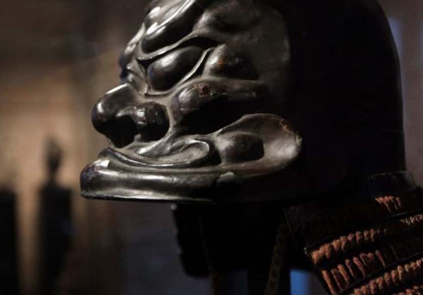 
An ancient helmet with a sculptured design at the Samurai Collection
