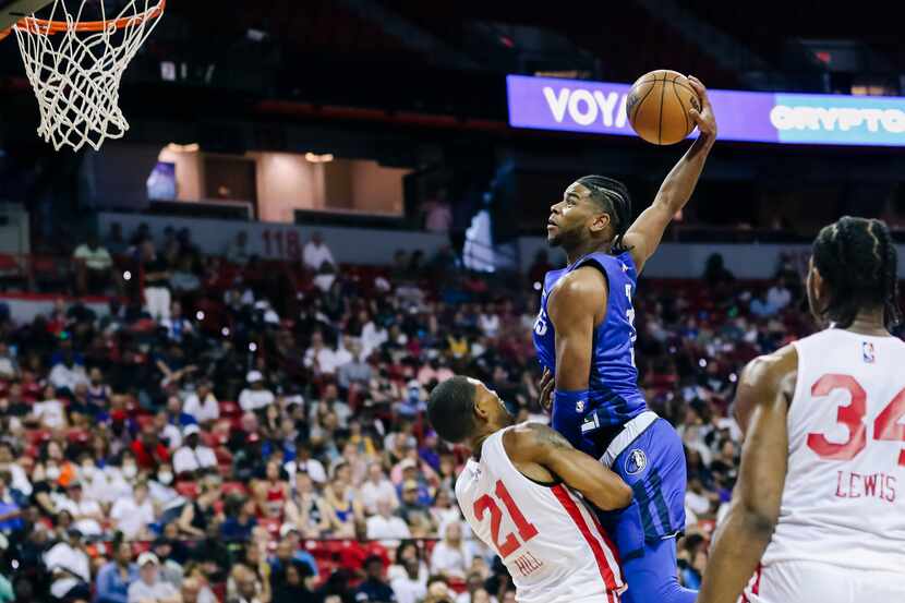 Dallas Mavericks' Jaden Hardy (3) goes for a dunk over Chicago Bulls' Malcolm Hill (21)...