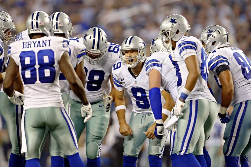 Dallas Cowboys quarterback Tony Romo (9) huddles during the second half against the New...