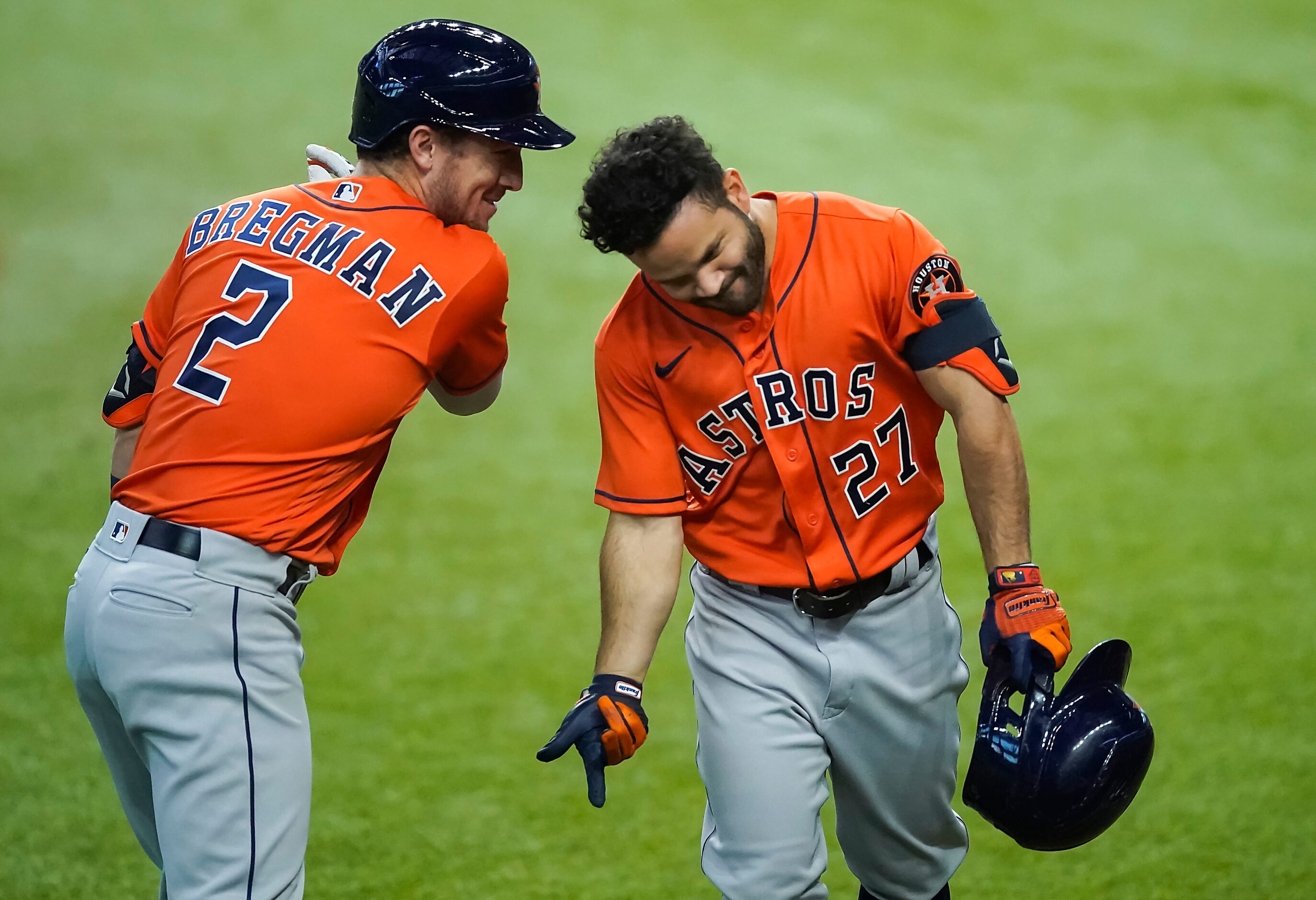 Houston Astros second baseman Jose Altuve celebrates with third baseman Alex Bregman after...