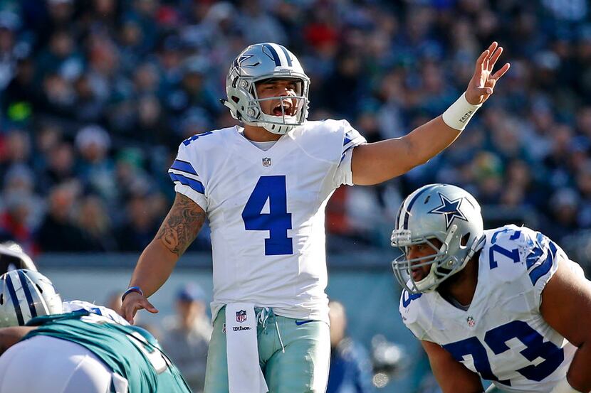 Dallas Cowboys quarterback Dak Prescott (4) yells at the line of a scrimmage against...